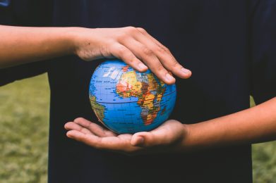 hand-holding-globe-for-earth-day-campaign-U3C3WAY